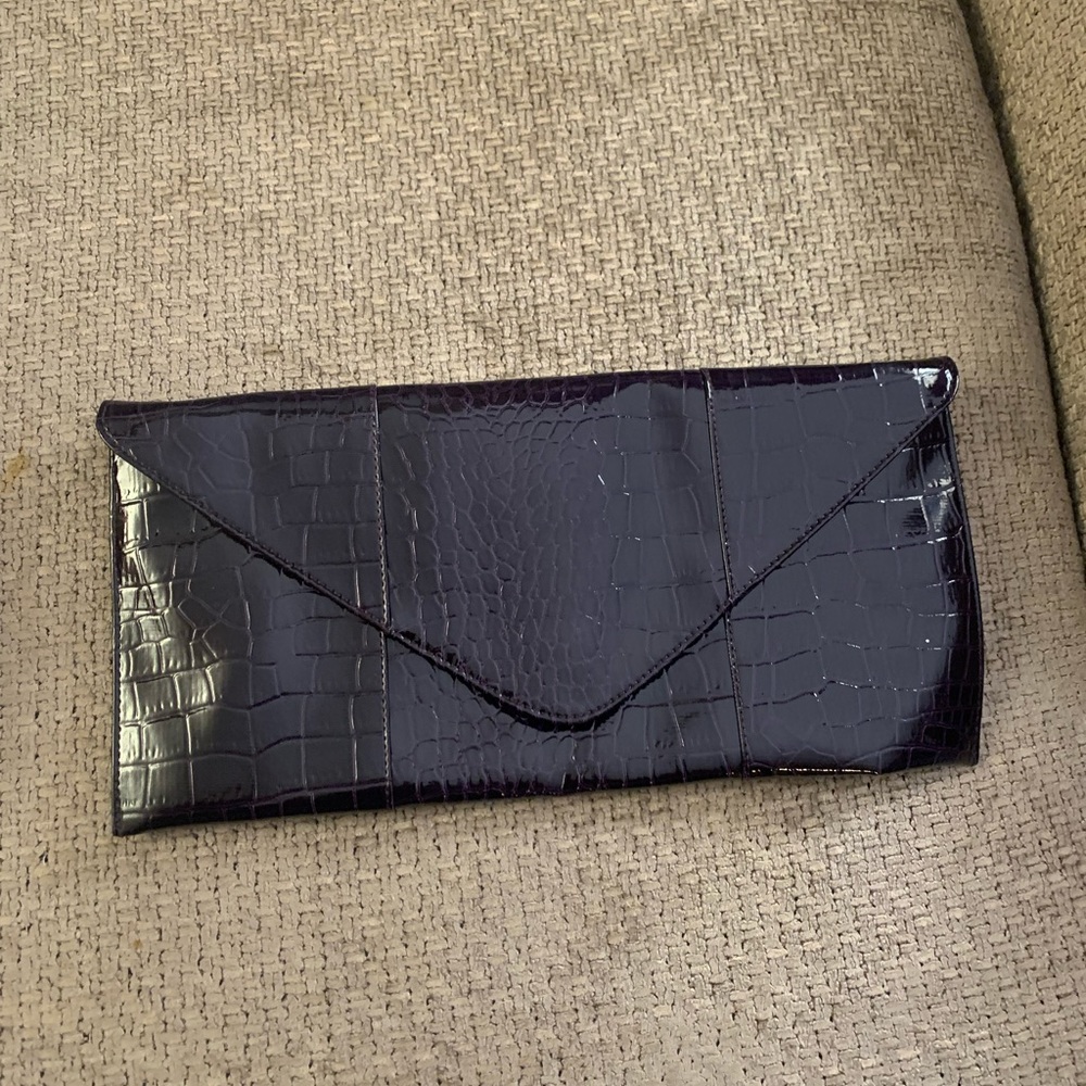 Purple envelope clutch with a chain strap. Never used